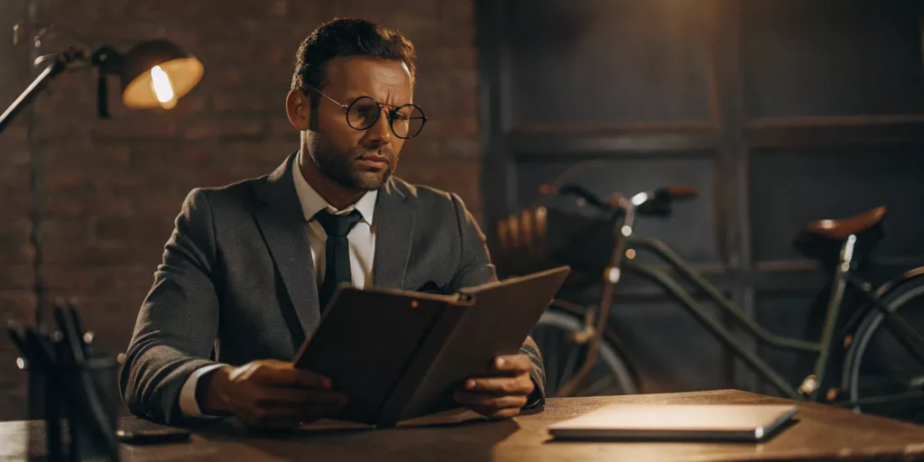 Personal injury lawyer reviewing case notes with a bicycle in the background