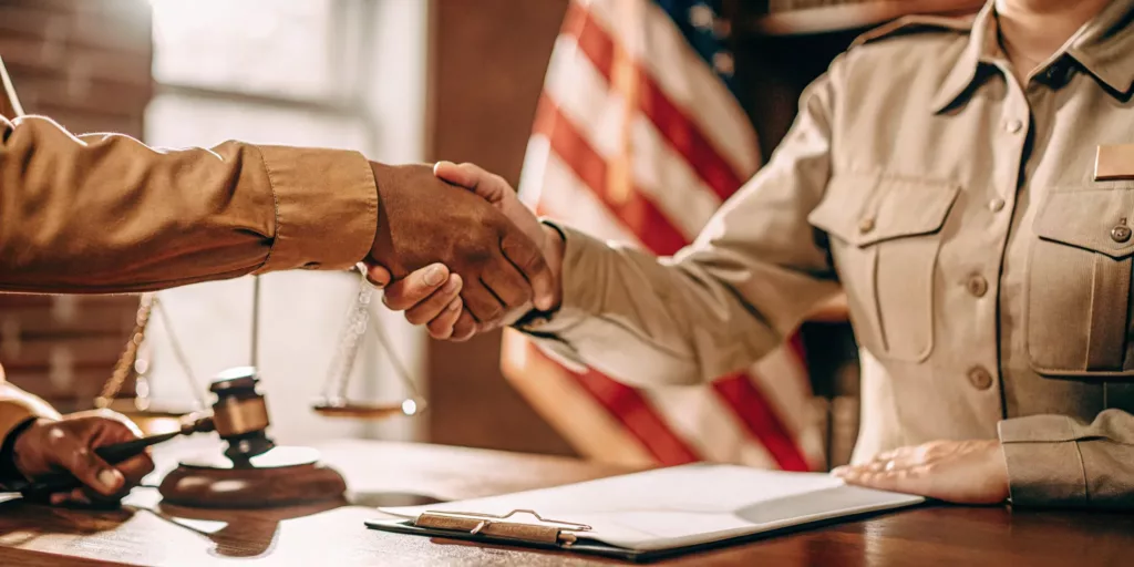 Compassionate personal injury lawyer meeting with an undocumented car accident victim in a professional law office